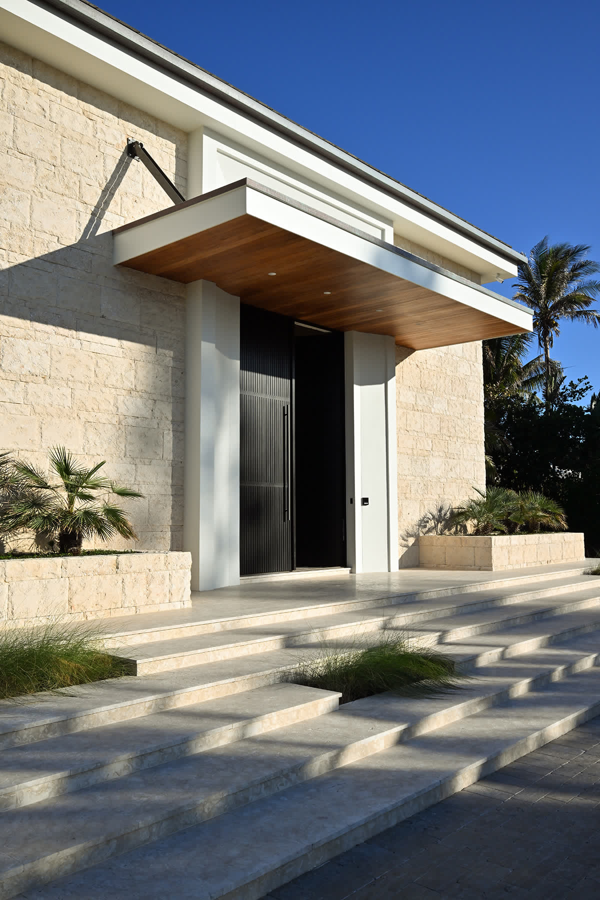 Modern entry in coral stone